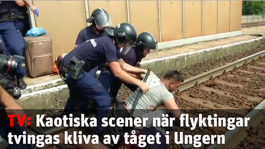 Kaotiska scener när flyktingar tvingas kliva av tåget